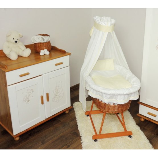 Wicker cot with white and cream set bedding