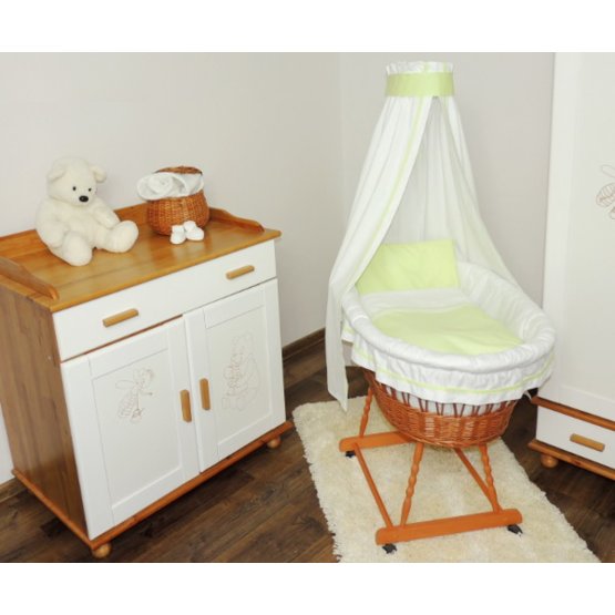 Wicker basket to baby with green set bedding